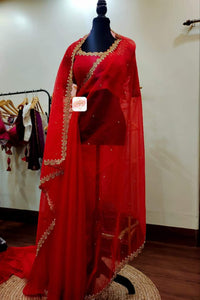 Organza saree with scallop embroidery borders paired with scallop neckline blouse- Blood Red